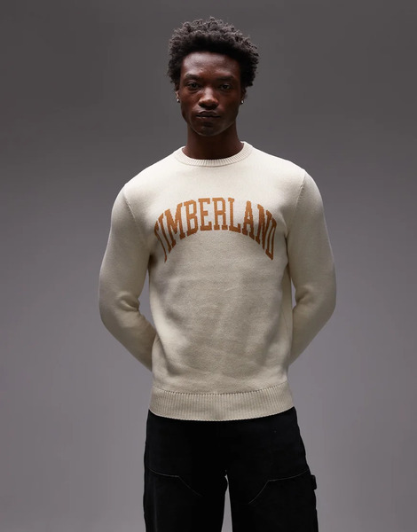  Timberland Jersey Blanco Hueso Con Cuello Redondo Y Logo En El Pecho De Estilo Universitario De Punto De Timberland 